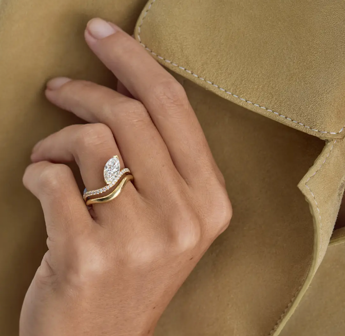 Marquise diamond engagement ring from Kimaiwith prongs and thin pavé band