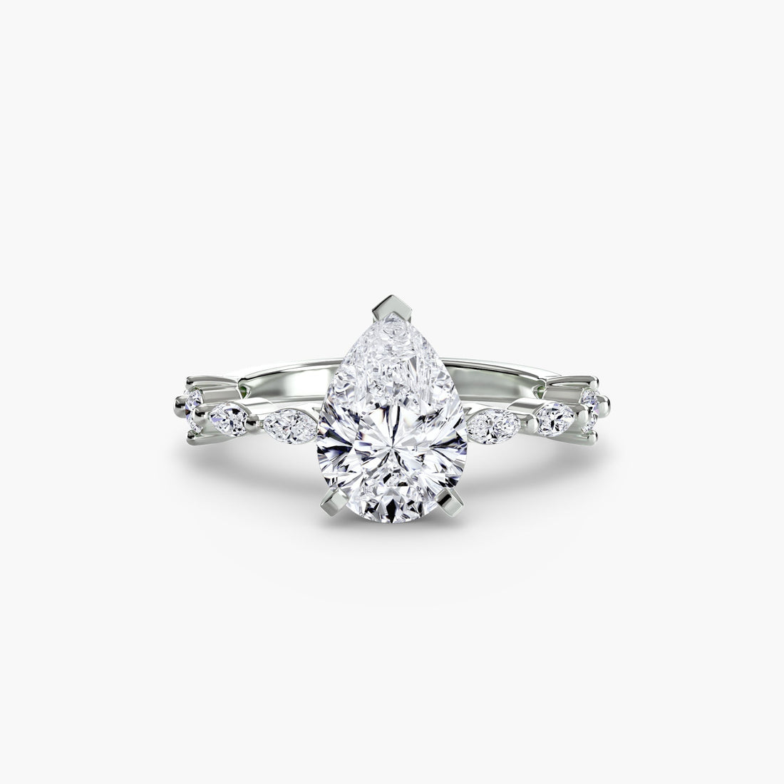 White gold pear-shaped diamond engagement ring with marquise side stones in a classic setting.
