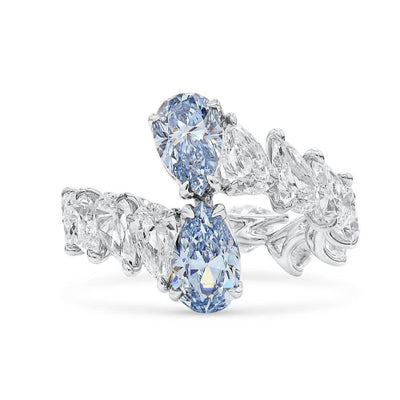 Lab Grown Diamond cocktail ring with blue diamonds on a white background